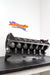Engine block on a stand with 'Atomic Performance' logo in the background