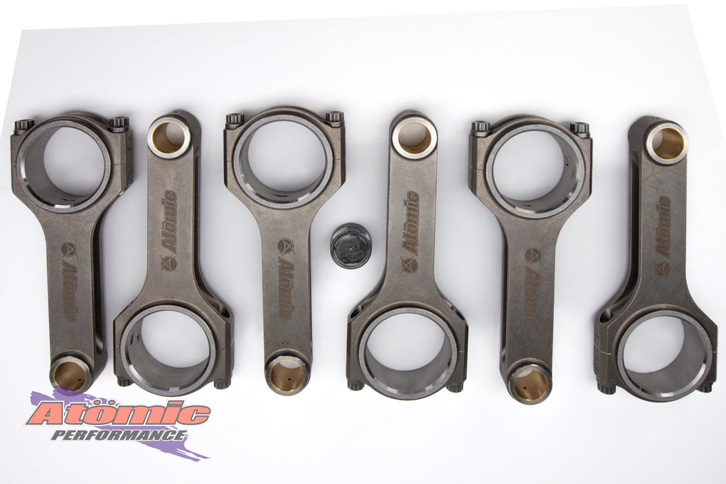 Set of connecting rods with Atomic Performance logo on a white background