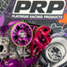 Close-up of purple and red engine components with PRP Platinum Racing Products branding in the background.