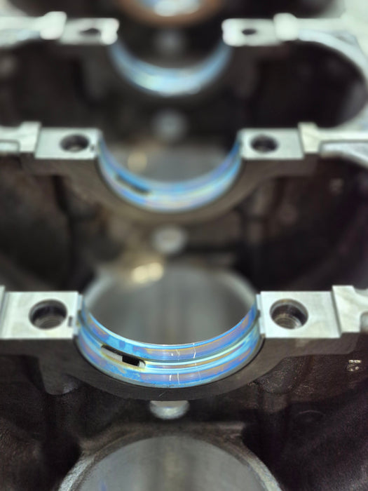 close-up of main bearing installation inside engine block