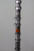 Metal camshaft on a gray background