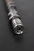 Close-up of a camshaft dowel on a dark background