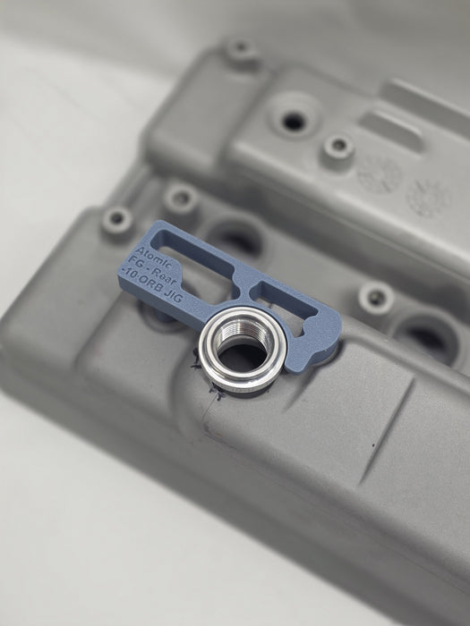 close up of weld on orb with 3d printed fitting jig on engine rocker cover with white background