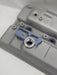 close up of weld on orb with 3d printed fitting jig on engine rocker cover with white background