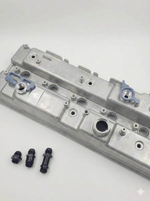 engine rocker cover with weld on fitting kit on a white background