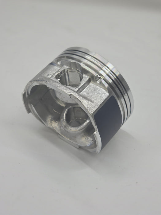 Metallic piston on a light gray background