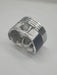 Metallic piston on a light gray background