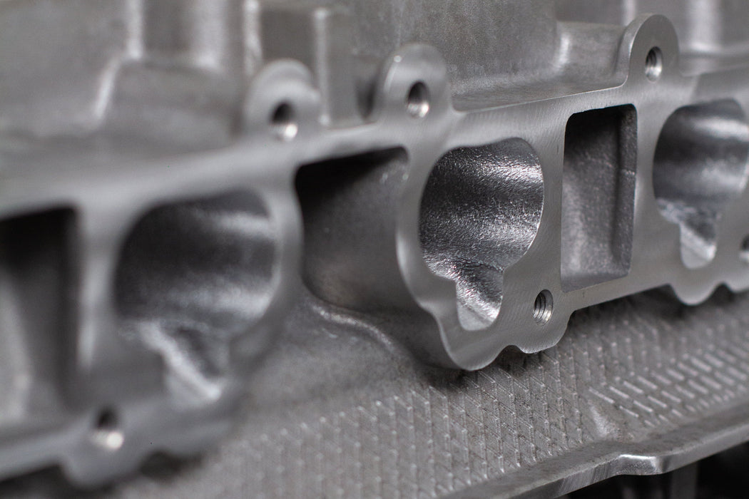 close up of a engine cylinder head intake ports
