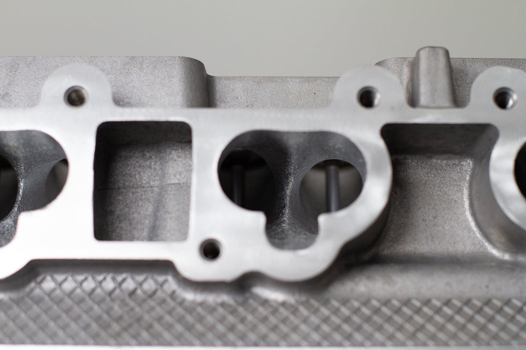 close up of engine cylinder head intake ports