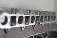 engine cylinder head exhaust port with engine numbers with a white background