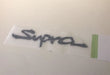 Genuine Toyota JZA80 Supra Gel "Supra" Badge - 75442-14280